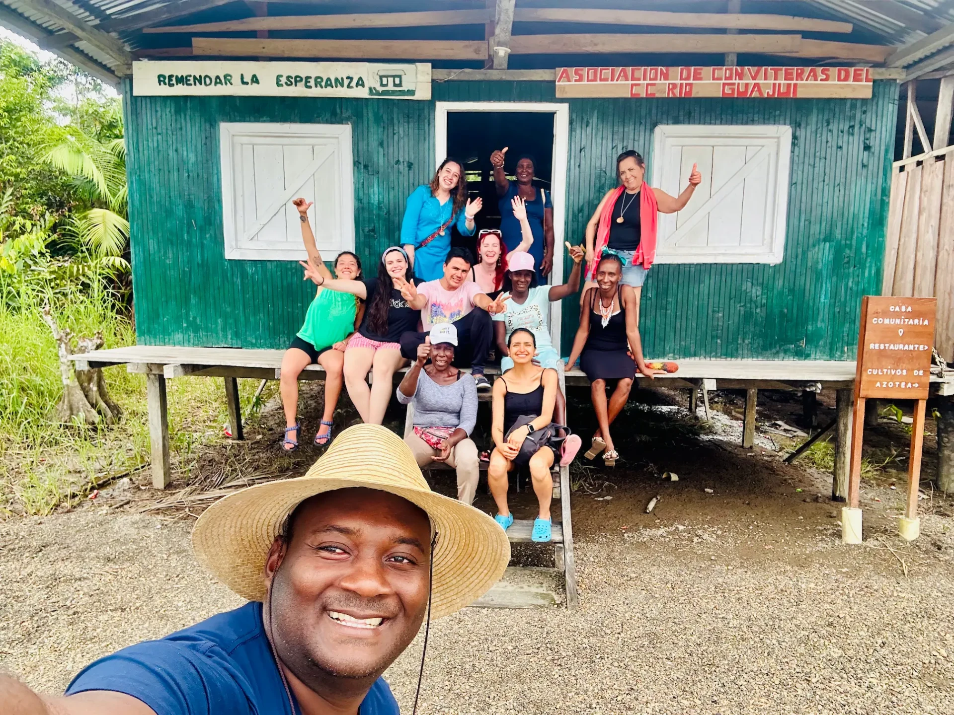 Travellers with the community at the house of the Conviteras Association of the Guajui river, Guapi