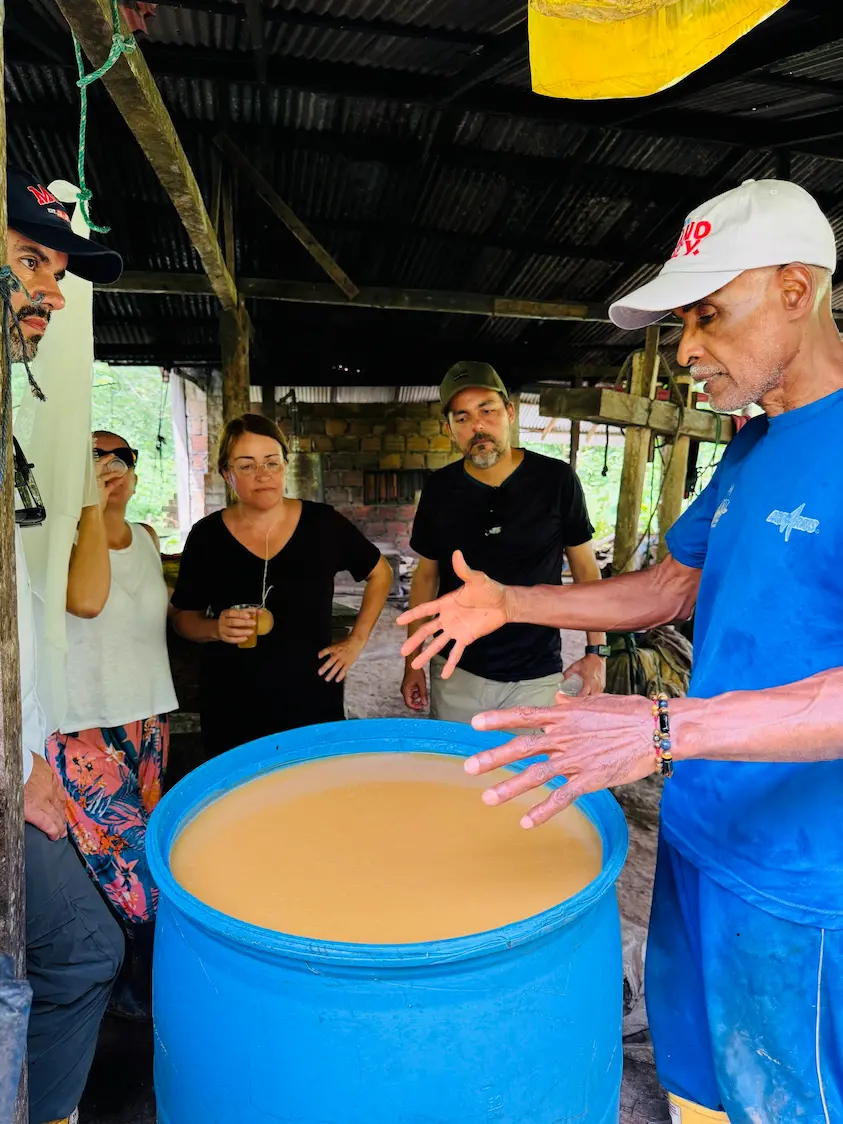 Don Onésimo, master viche maker, explaining how viche is made in Soledad Cuary
